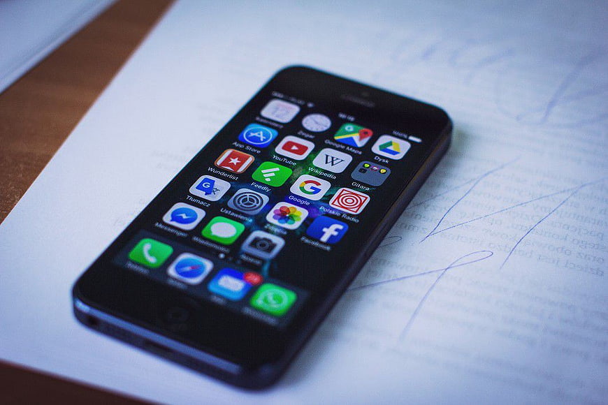 Black Smartphone on Paper with Handwritten Notes