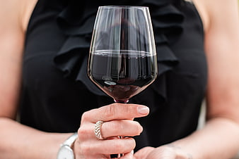Woman Holding Glass of Red Wine