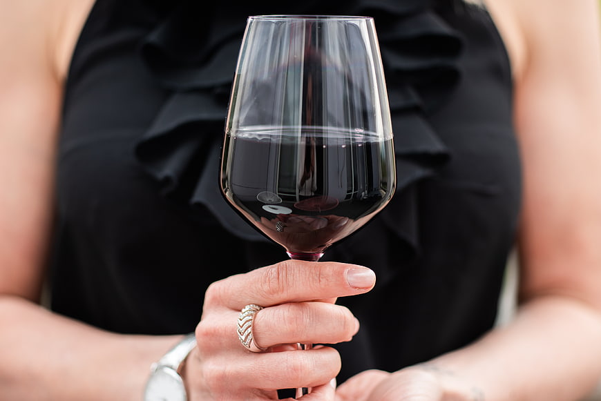 Woman Holding Glass of Red Wine