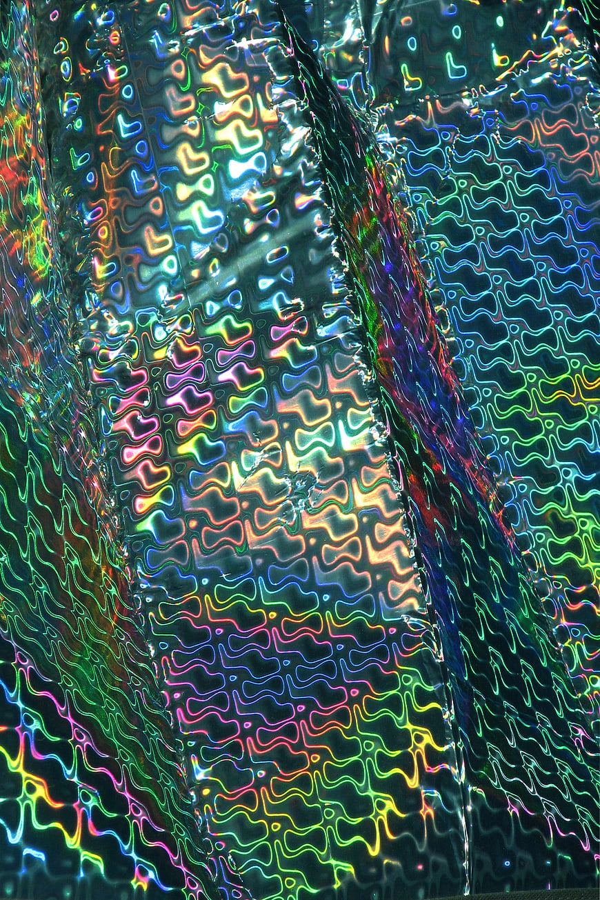 Abstract Iridescent Foil Texture with Rainbow Holographic Patterns