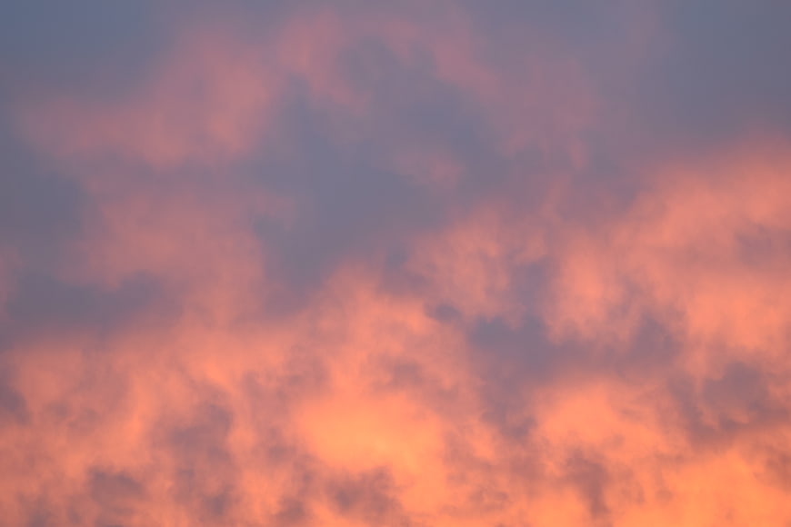 Vibrant Pink and Orange Sunset Clouds Sky Background