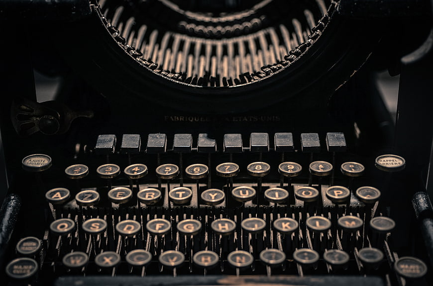 Close-up of vintage black typewriter with AZERTY keys
