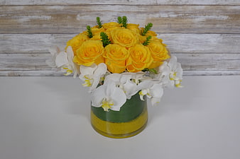 Yellow Roses and White Orchids in Decorative Vase