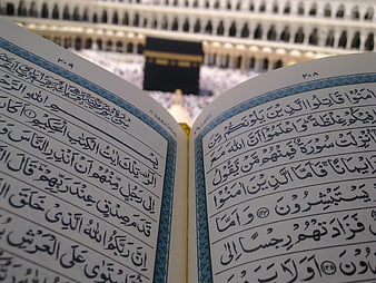 Quran with Kaaba in Background at Masjid al-Haram