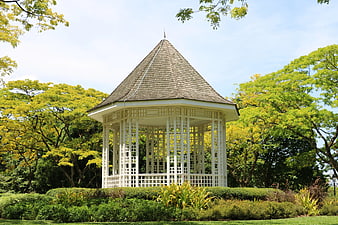 White Octagonal Gazebo in Lush Green Park