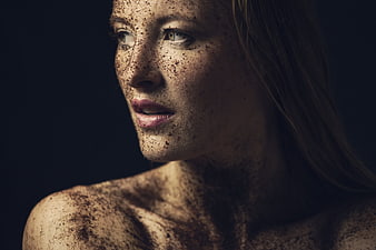 Artistic Portrait of Woman with Freckles and Dark Powder