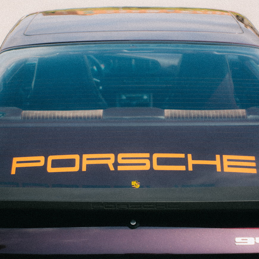 Vintage Porsche Rear Detail with Orange Lettering