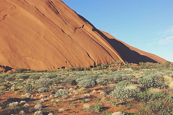 Uluru rock formation in Australian outback desert landscape