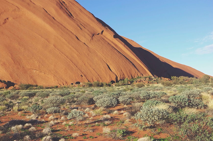 Uluru rock formation in Australian outback desert landscape