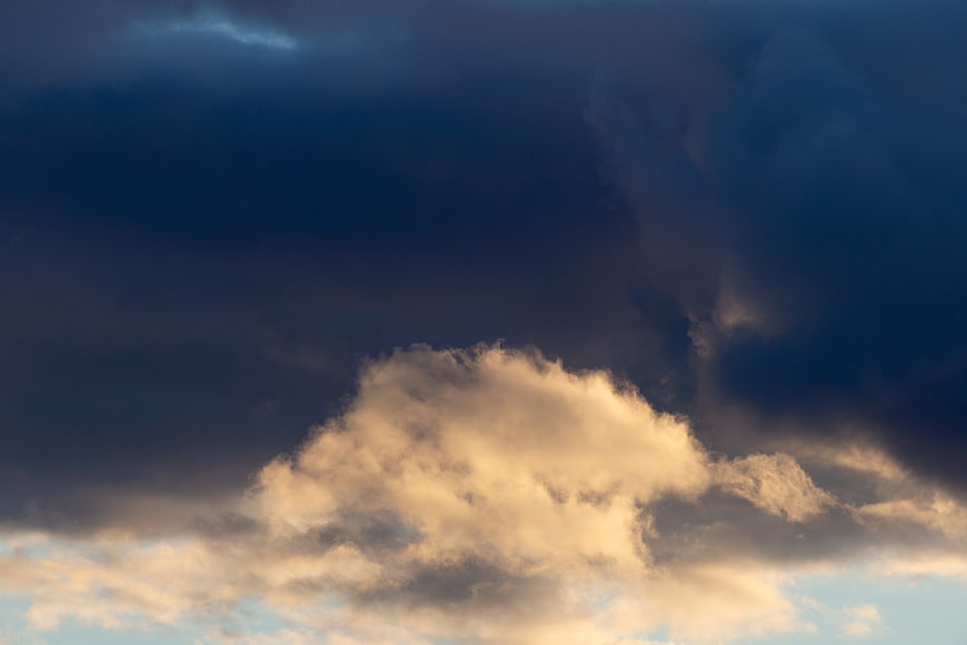 Dramatic Storm Clouds with Golden Sunlight Breaking Through