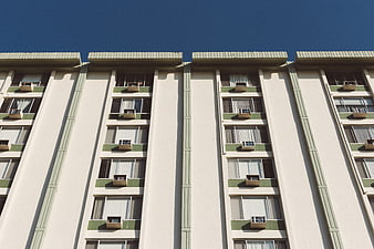 Low angle view of retro apartment building facade