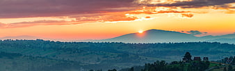 Panoramic sunset over rolling hills and mountains in Poland