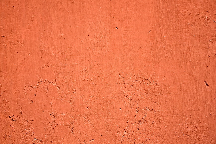Textured Orange Plaster Wall Surface Background