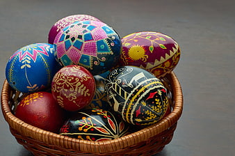 Colorful Hand-Painted Easter Eggs in Wicker Basket