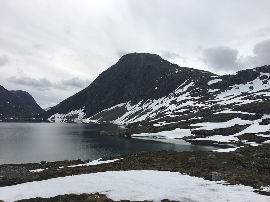 Snowy Mountain Landscape with Lake in Norway