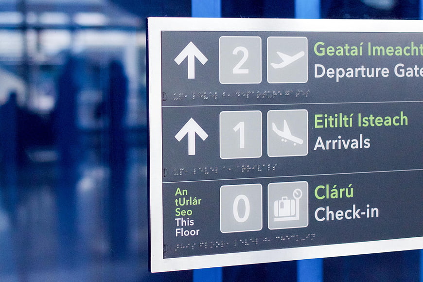 Bilingual Airport Directional Sign with Icons