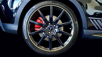 Close-up of Mercedes-Benz AMG alloy wheel with red brake calipers