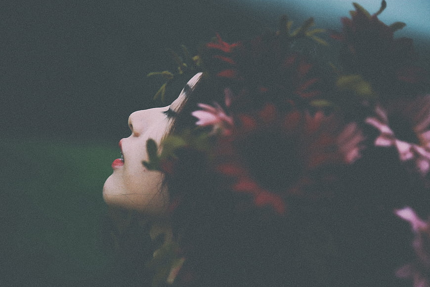 Artistic Profile of Woman with Flowers in Dark Moody Style