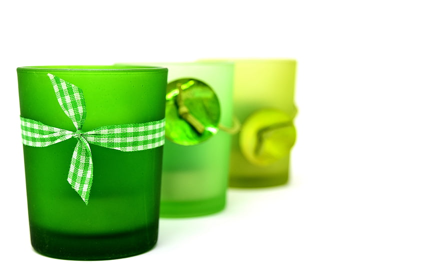 Green Glass Candle Holders With Gingham Ribbon On White Background