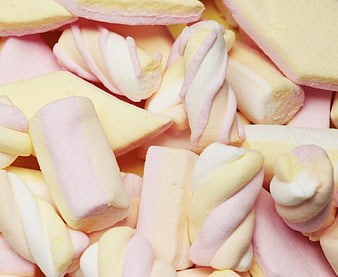 Close-up of colorful pastel marshmallows in pink, yellow, and white