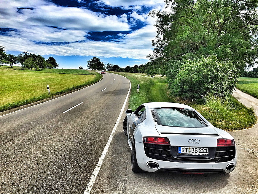 White Audi R8 Sports Car Parked on Curved Country Road