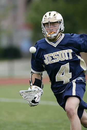 Lacrosse Player Running with Ball on Field