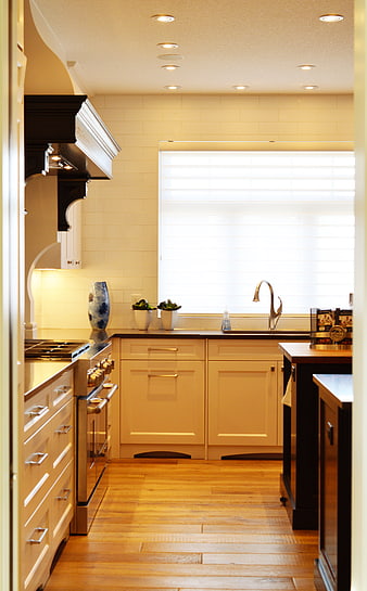 Modern Kitchen Interior With Cream Cabinets And Hardwood Floors