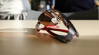 Close-up of stylish sunglasses on a wooden table