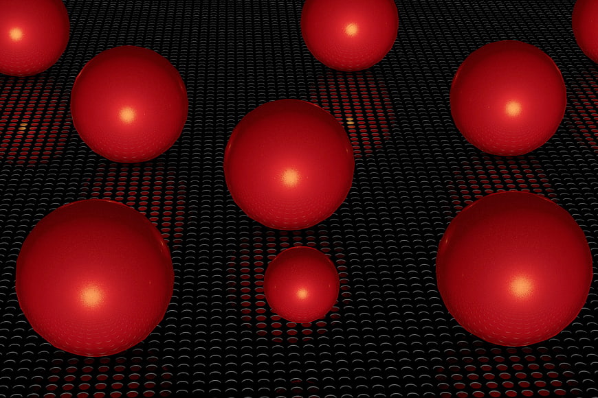 Red spheres on black perforated metal background