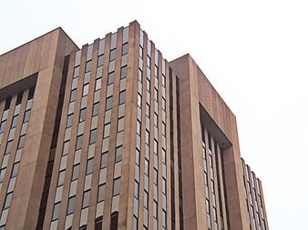 Low angle view of modern brown office building facade