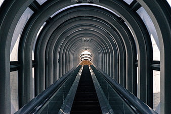 Symmetrical Escalator Tunnel with Arched Architecture