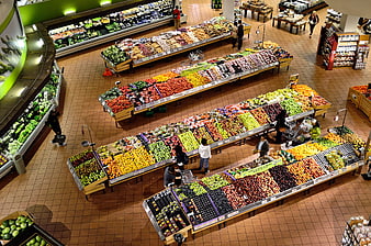 High angle view of colorful fresh fruit and vegetable section in supermarket