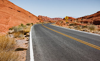 Winding Desert Road Through Red Rock Canyon Landscape