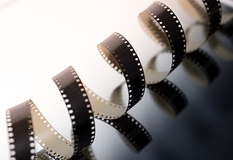 Vintage Film Strip on Reflective Surface