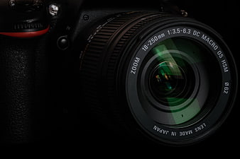Close-up of Professional DSLR Camera Lens on Black Background