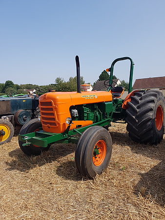 Vintage Orange and Green Someca Tractor in Hayfield