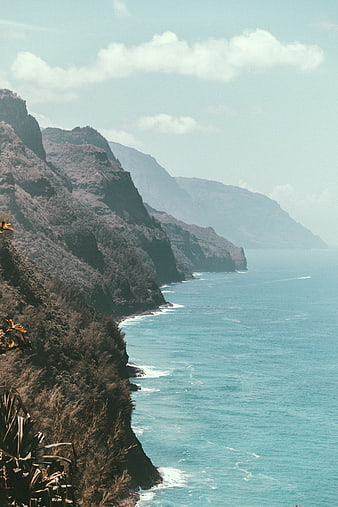Dramatic coastal cliffs meeting turquoise ocean waters