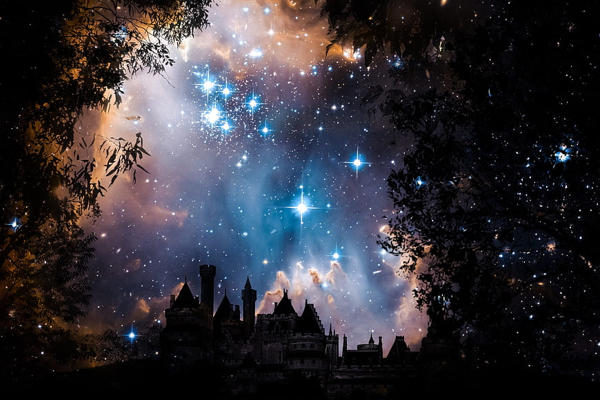 Fantasy castle silhouette against vibrant starry nebula sky