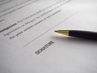 Pen on Contract Signature Line Close Up