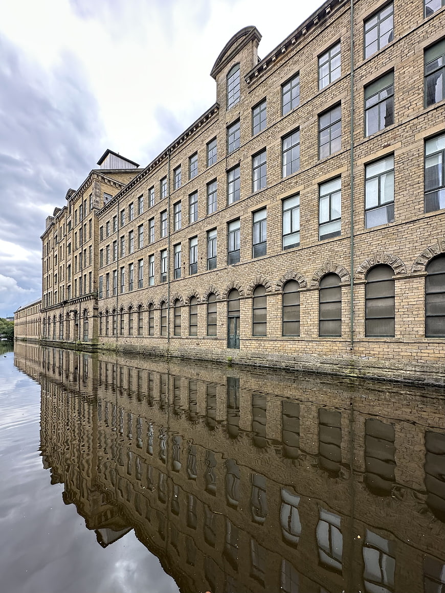 Historic Brick Warehouse Building Reflected in Canal Water