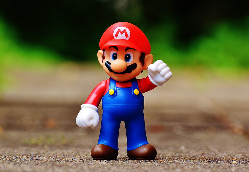 Super Mario Bros Figure Toy on Outdoor Path