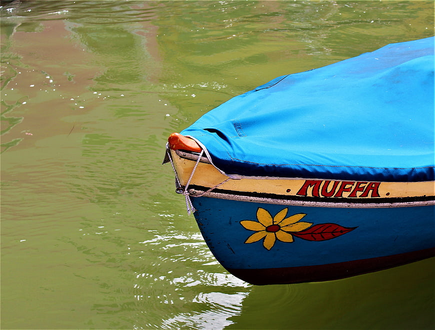 Colorful Venetian Boat Named Muffa in Murano Canal