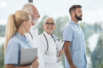 Diverse Medical Team Standing Together in Hospital