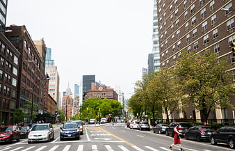Urban City Street with Traffic and Woman in Red Dress