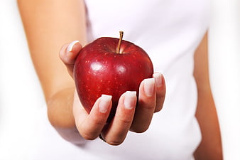 Woman Holding Fresh Red Apple for Healthy Diet