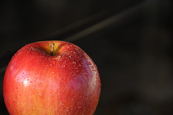 Close-up of a Red Apple with Water Droplets