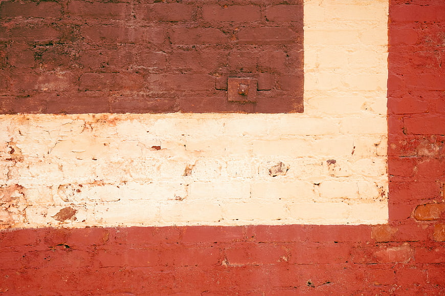 Textured Red and White Painted Brick Wall Background