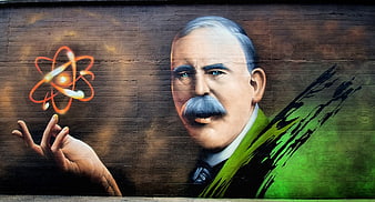Street Art Mural of Ernest Rutherford with Atom Symbol