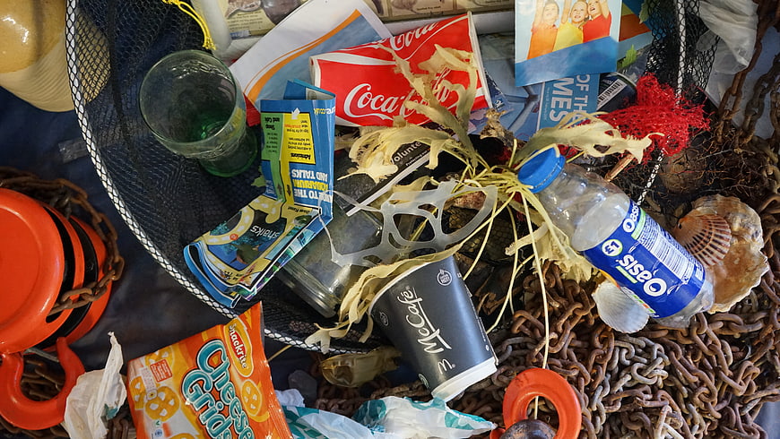 Beach Litter and Plastic Waste on Rusty Chains