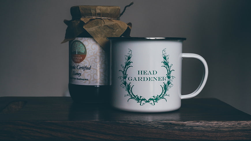 Head Gardener Mug and Organic Honey Jar on Wooden Table